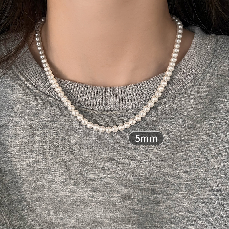 Gyöngy nyaklánc gyöngyház medállal, U-formájú kialakítás, Seiko kezelés, egyszerű, texturált, könnyed luxus stílus