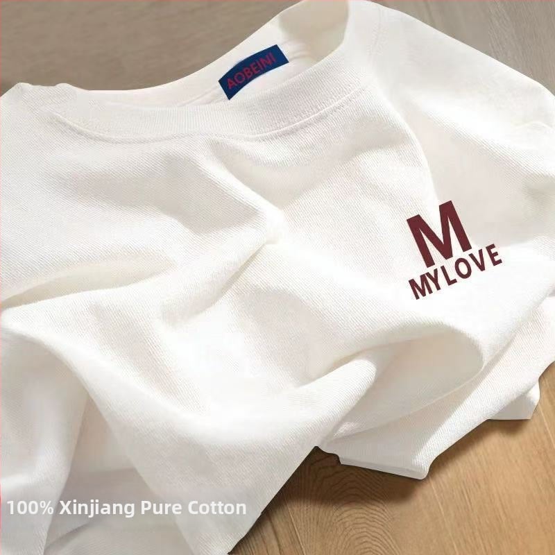 Sieviešu kokvilnas T-krekls ar apaļu kakla izgriezumu, īsiem piedurknēm, brīvā piegriezuma, ar teksta druku