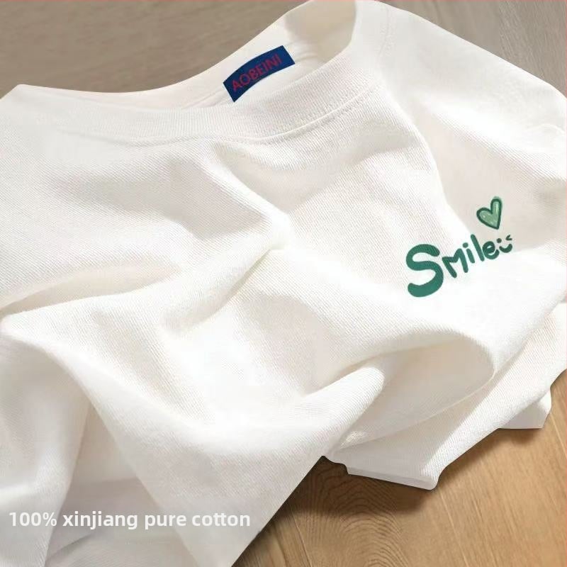 Sieviešu kokvilnas T-krekls ar apaļu kakla izgriezumu, īsiem piedurknēm, brīvā piegriezuma, ar teksta druku