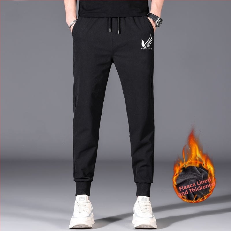 Flīša pildītas darba bikses ar brīvu piegriezumu, potītei aizsiets auklu, poliesteru audums