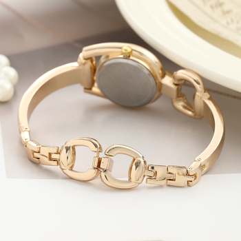 Sieviešu kvarca pulkstenis ar retro pogu dizainu, apaļš ciparnīcas diametrs 23 mm, biezums 12 mm, korpuss no cinka sakausējuma