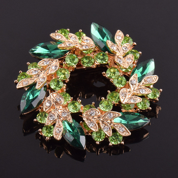 Broš od legure, zlatno ugravirani motiv Bauhinijevog cvijeta, marka Himana, za žensku uredsku modu