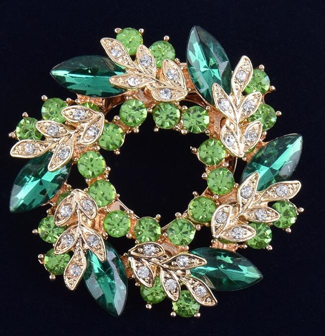 Broš od legure, zlatno ugravirani motiv Bauhinijevog cvijeta, marka Himana, za žensku uredsku modu