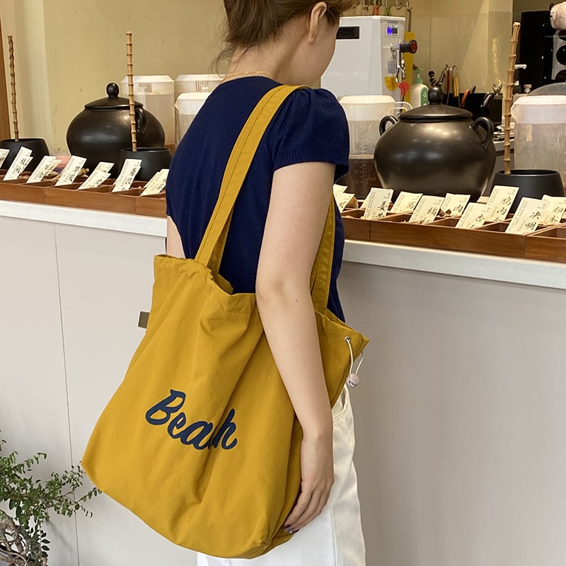 Nylon plecu soma ar šņorēm – pilsētas vienkāršs stils, iekšējā kabata ar rāvējslēdzēju un telefona kabatiņa, poliestera oderde