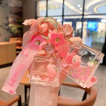 Képregényes kulcstartó, akril üvegben mozgó homokkal, gyerekek iskolatáskához