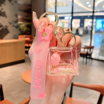 Képregényes kulcstartó, akril üvegben mozgó homokkal, gyerekek iskolatáskához