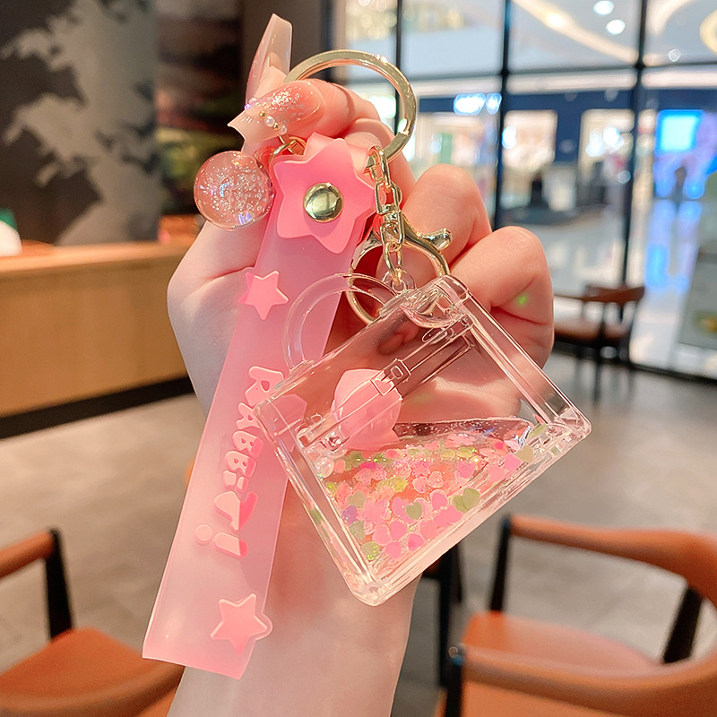 Képregényes kulcstartó, akril üvegben mozgó homokkal, gyerekek iskolatáskához