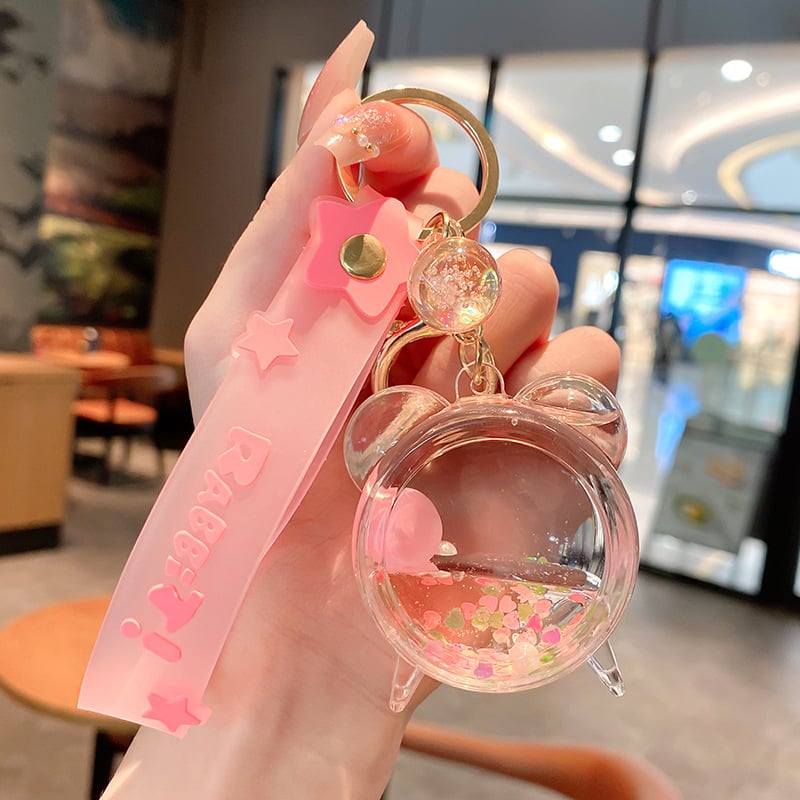 Képregényes kulcstartó, akril üvegben mozgó homokkal, gyerekek iskolatáskához