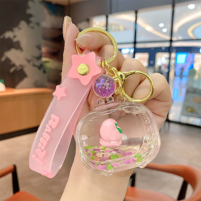 Képregényes kulcstartó, akril üvegben mozgó homokkal, gyerekek iskolatáskához