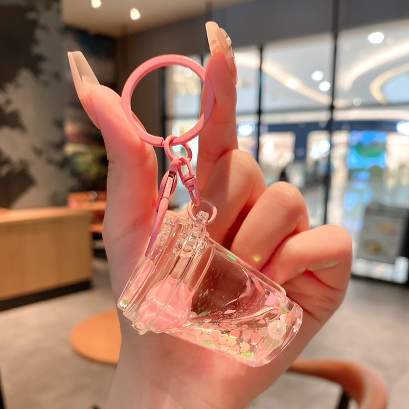 Képregényes kulcstartó, akril üvegben mozgó homokkal, gyerekek iskolatáskához