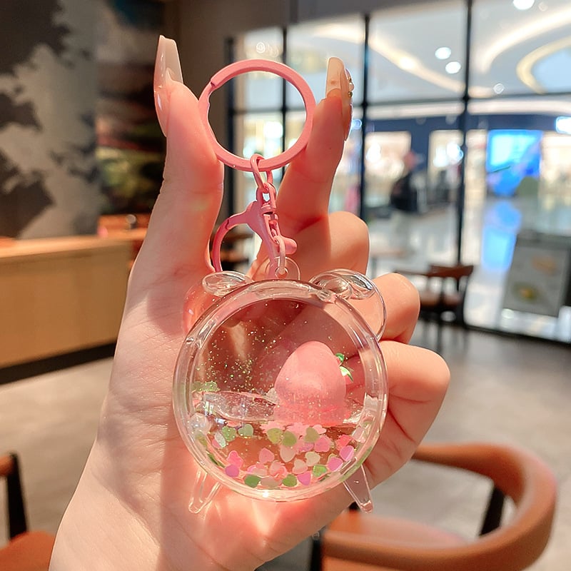 Képregényes kulcstartó, akril üvegben mozgó homokkal, gyerekek iskolatáskához