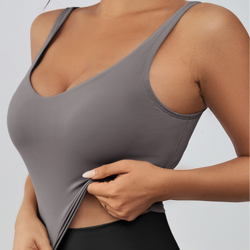 Sporta krūšturis skrējienam un jogai, bez stieplēm, ar noņemamiem pildījumiem, platām plecu siksnām, īss griezums, materiāls: neilons (poliamīds)