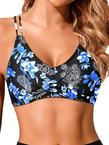 Divdaļīgs bikini peldkostīms ar krustotām siksniņām un krūšu spilventiņiem; ziedu raksts; materiāls poliesters 85% (pildījums 85% poliesters); bez piedurknēm, bikini siluets