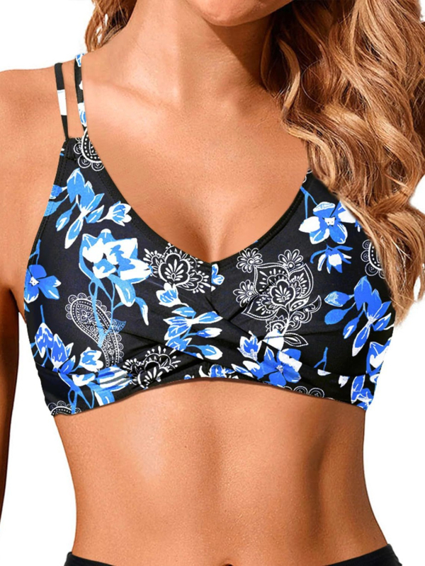 Divdaļīgs bikini peldkostīms ar krustotām siksniņām un krūšu spilventiņiem; ziedu raksts; materiāls poliesters 85% (pildījums 85% poliesters); bez piedurknēm, bikini siluets