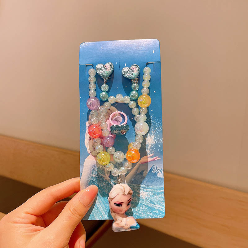 Set dječjih nakita s likom crtića — višeslojni lanac od perlica sa privjesom od legure; uključuje ogrlicu, narukvicu, prsten i naušnice