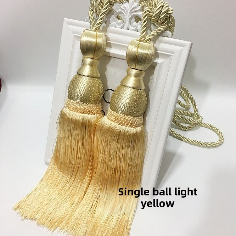 Aizkaru aukli - zelta stieples bumbiņa ar pušķi (audums)