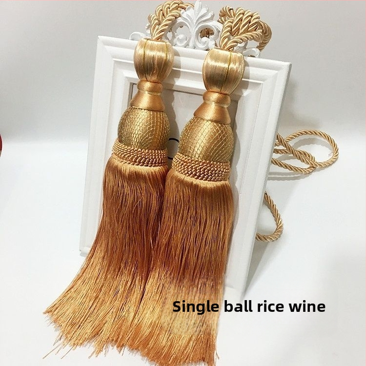 Aizkaru aukli - zelta stieples bumbiņa ar pušķi (audums)