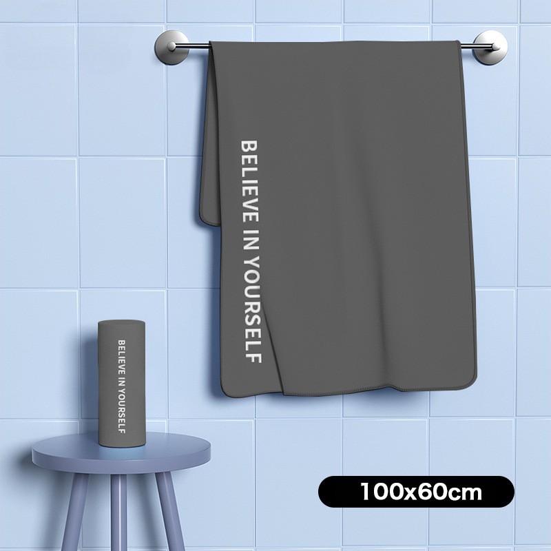 Nēsājamais mikroviļņu dvieļu pludmales pončo – ātri žūst, viegls, ar pogu kapuci; Materiāls: mikrofibra; Svars zem 100 g; Diegs: 150D; Jacquard aušana