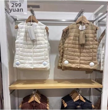 Moteriška liemenė iš antis pūkų, apvalus kaklas, vienos eilės užtrauktukas, pūkų sudėtis 50%, ilgis 50–65 cm