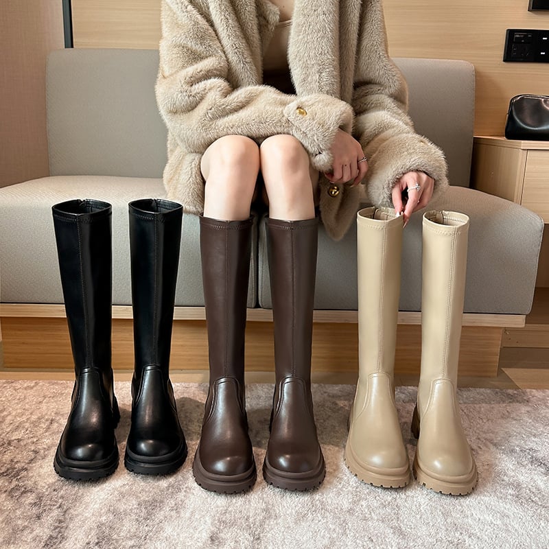 Moteriški kelių ilgio botai su fleece įdėklu, aukštas vamzdelis, klininis kulnas 6–8 cm, užtrauktukas gale, išorinis audinys: karvės odos antrinė