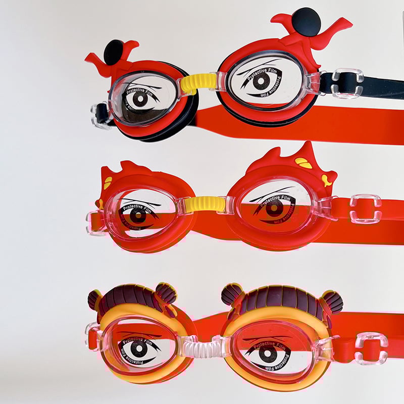 Bērnu peldēšanas brilles ar karikatūru dizainu, PC lēcas, ūdensdrošas un pret miglošanos, komplektā peldcepure