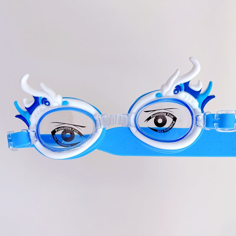 Bērnu peldēšanas brilles ar karikatūru dizainu, PC lēcas, ūdensdrošas un pret miglošanos, komplektā peldcepure