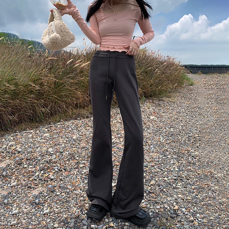 Moteriškos sportinės kelnės su švelniai išsiplėšiančiu kelniu, žieminis fliso pamušalas, žemas juosmuo, ilgos iki grindų, poliesterio–medvilnės mišinys