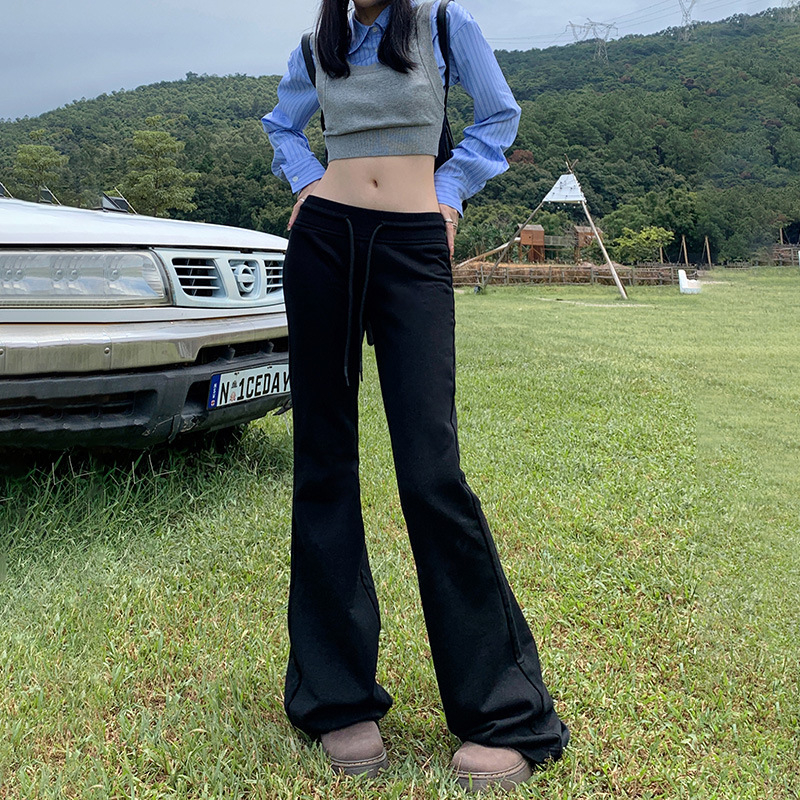 Moteriškos sportinės kelnės su švelniai išsiplėšiančiu kelniu, žieminis fliso pamušalas, žemas juosmuo, ilgos iki grindų, poliesterio–medvilnės mišinys