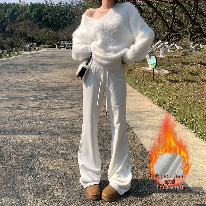 Moteriškos sportinės kelnės su švelniai išsiplėšiančiu kelniu, žieminis fliso pamušalas, žemas juosmuo, ilgos iki grindų, poliesterio–medvilnės mišinys