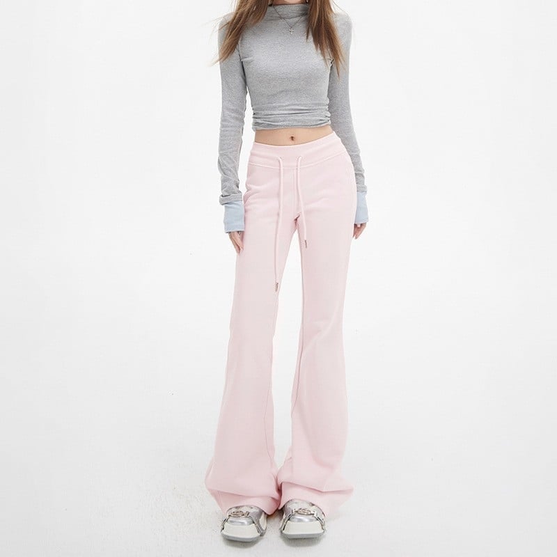 Moteriškos sportinės kelnės su švelniai išsiplėšiančiu kelniu, žieminis fliso pamušalas, žemas juosmuo, ilgos iki grindų, poliesterio–medvilnės mišinys