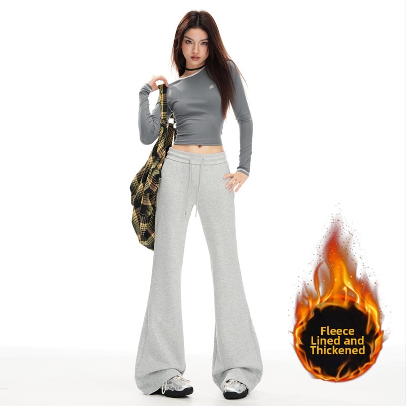 Moteriškos sportinės kelnės su švelniai išsiplėšiančiu kelniu, žieminis fliso pamušalas, žemas juosmuo, ilgos iki grindų, poliesterio–medvilnės mišinys