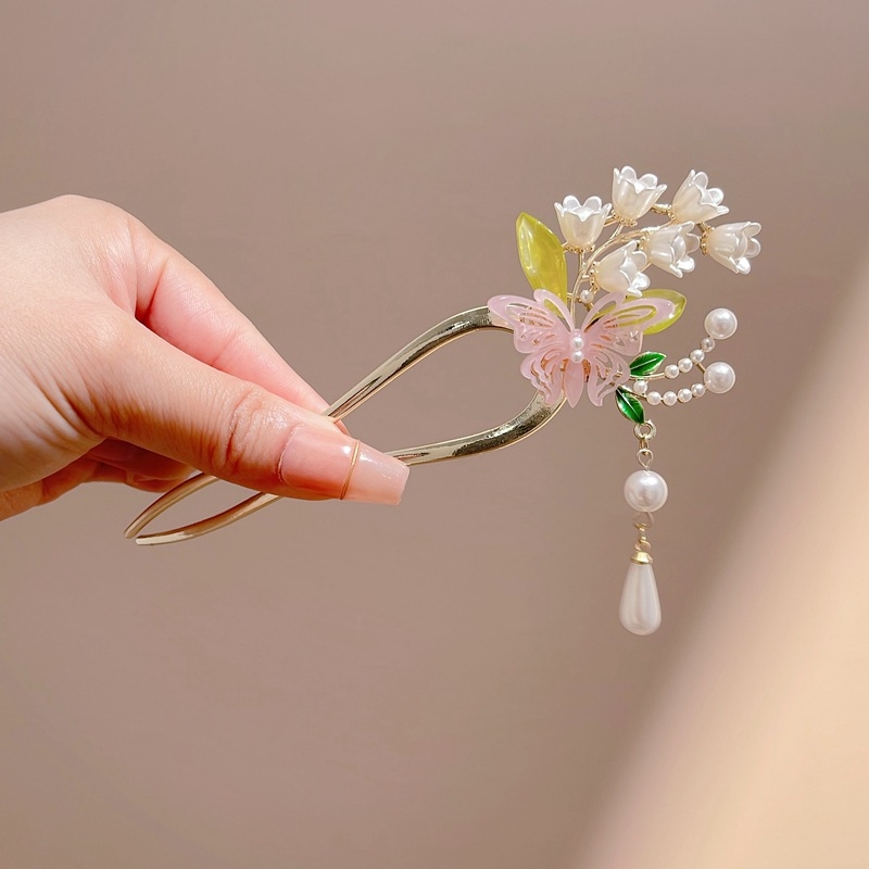 Matu spraude ar antīkā stila motīvu, zieds un tauriņš, perlīšu aukla, sakaļa apdare