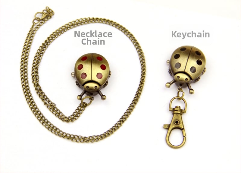 Võtmehoidja koos mini taskukellaga, karikatuurstiilis, kvartsliikumine, metallkorpus, analoogne ekraan, klaas