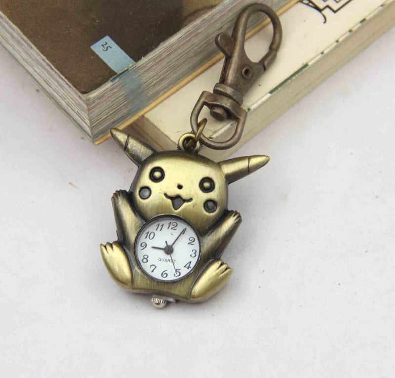 Võtmehoidja koos mini taskukellaga, karikatuurstiilis, kvartsliikumine, metallkorpus, analoogne ekraan, klaas