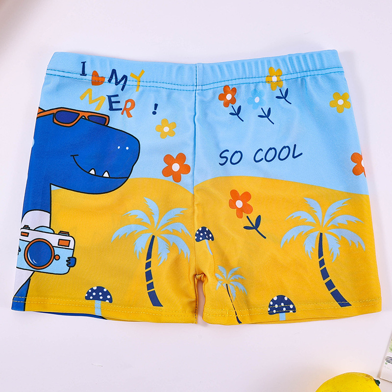 Vaikų plaukimo šortai su karikatūrų spauda, kvėpuojantys, greitai džiūstantys; audinys poliesteris 88%, vidinis pamušalas 12%