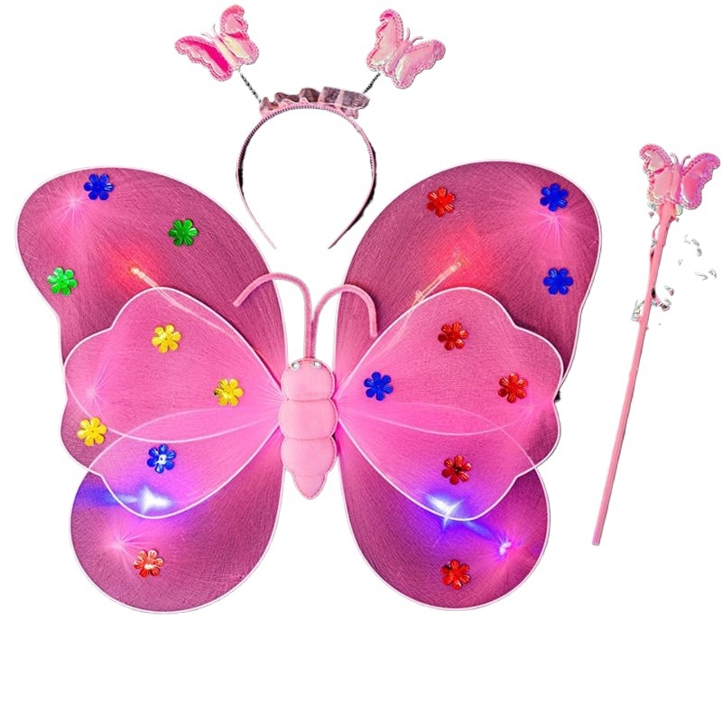 Mergaičių švytintys drugelių sparnai — audinys, animacinis stilius, sceninis rekvizitas