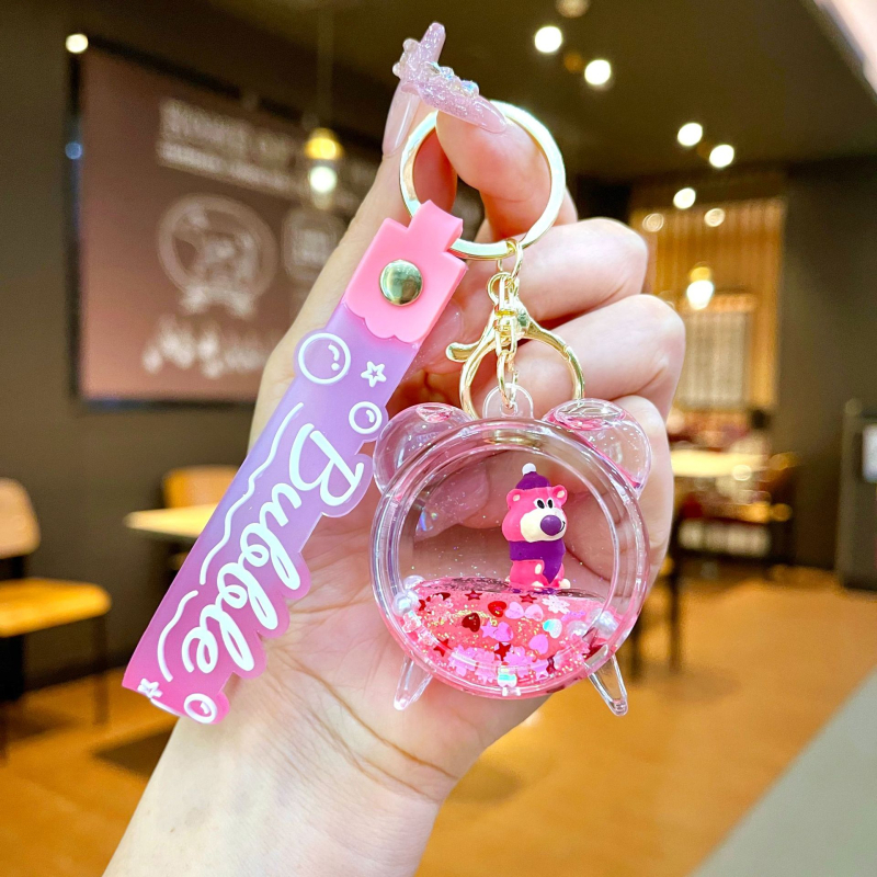 Akrüülne võtmehoidja, multikas stiil, karu motīvā ar maasikatega, quicksand efekts