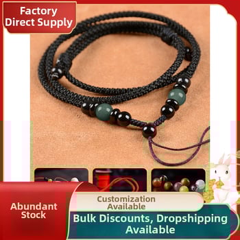 Hetianos nefrito pakabukas ant rankų pintos vėrinio, apdorotas nefritas