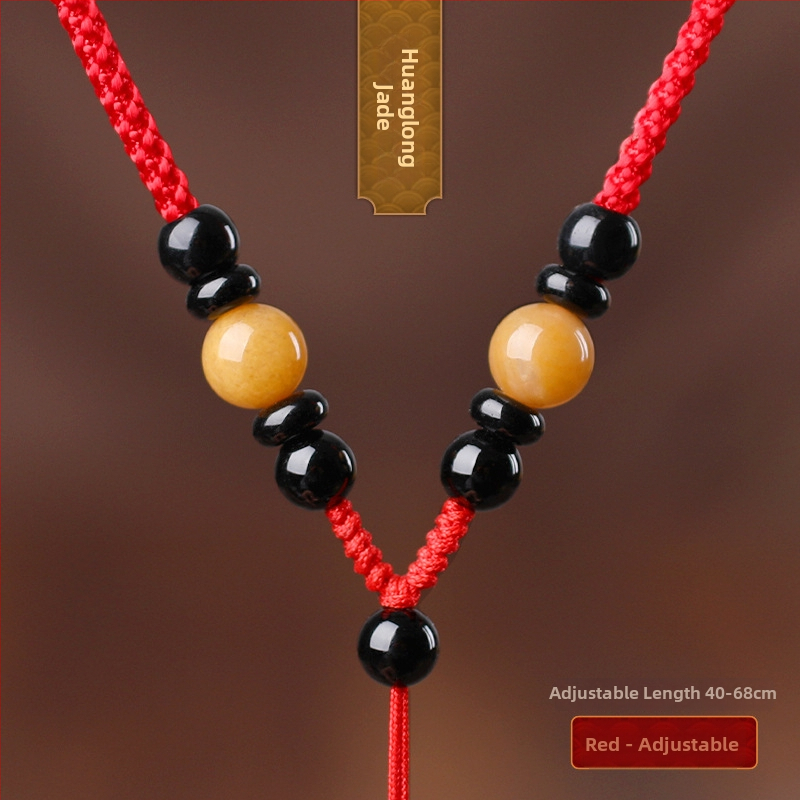 Hetianos nefrito pakabukas ant rankų pintos vėrinio, apdorotas nefritas