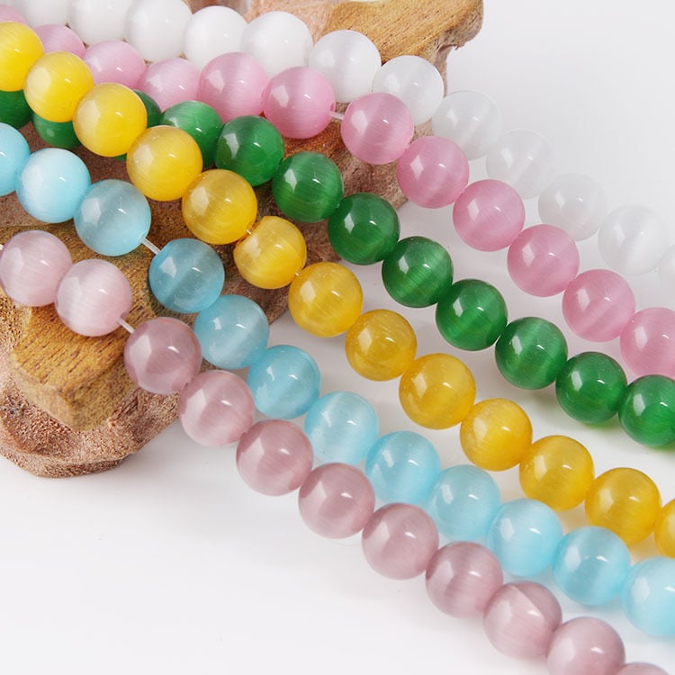 Laisvos karoliukai – katės akies akmens krištolo karoliukai, poliruoti, Korėjos stilius, kilnus raštas