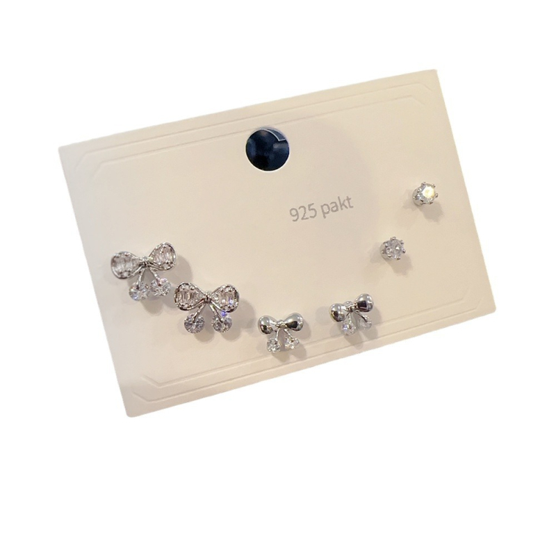 Set de cercei din cupru cu micro-incrustare cu zirconiu, finisaj micropavé; forme variate: personaje, frunză, stea, geometric, animale, litere