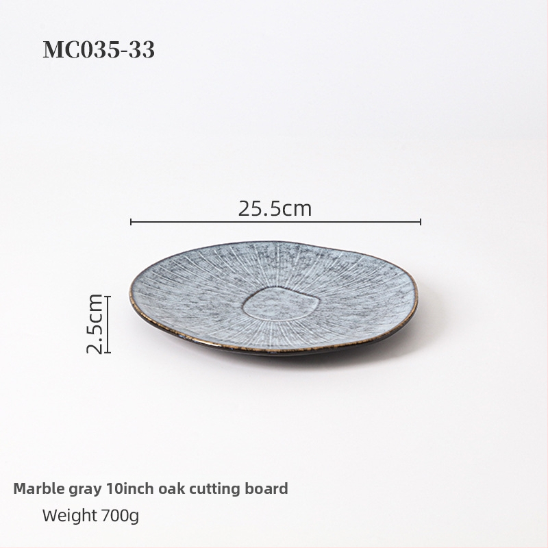 Porcelanski reljefni plitki tanjur, krušnog oblika, s pećnom glazom, pogodan za mikrovalnu