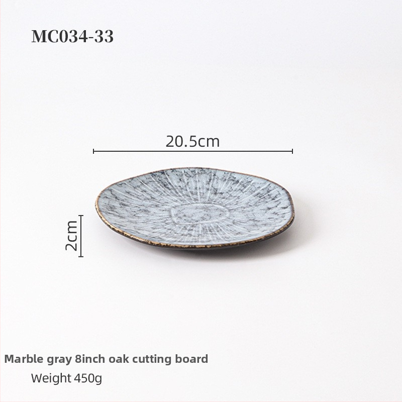 Porcelanski reljefni plitki tanjur, krušnog oblika, s pećnom glazom, pogodan za mikrovalnu