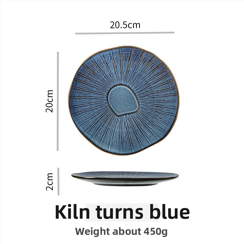 Porcelanski reljefni plitki tanjur, krušnog oblika, s pećnom glazom, pogodan za mikrovalnu