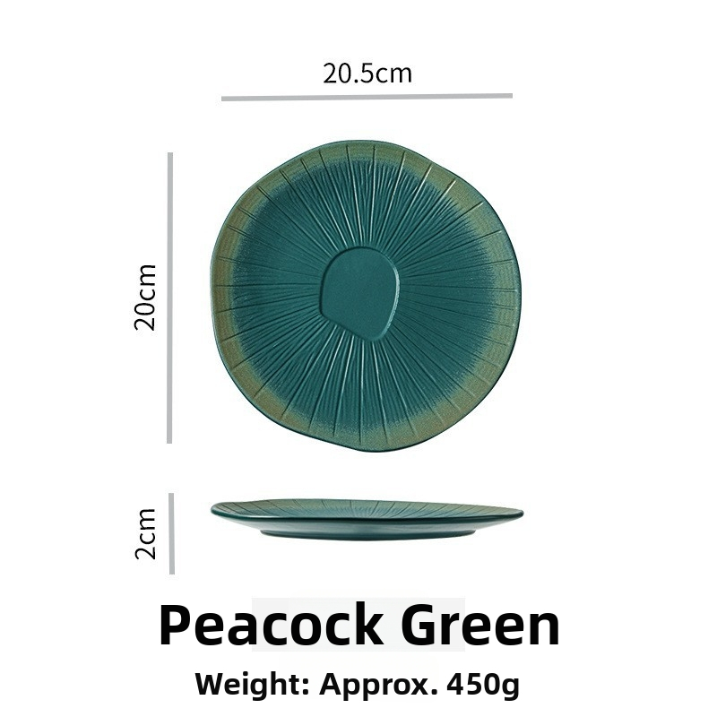 Porcelanski reljefni plitki tanjur, krušnog oblika, s pećnom glazom, pogodan za mikrovalnu