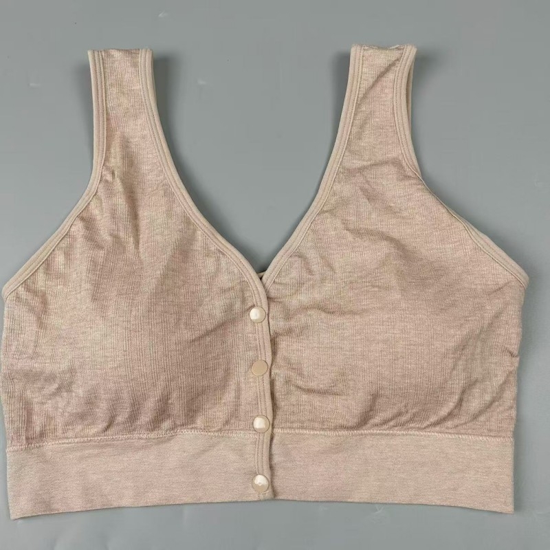 Dojančios liemenėlė be siūlių, priekiniame užsegime sagtys, vest stiliaus, fiksuoti puodeliai, nailono audinys