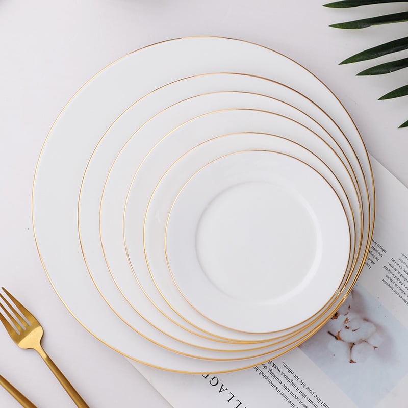 Porcelinasti kružni plitki tanjur za posluživanje sa zlatnim obrubom; jednofarban dizajn; mikrovalna sigurna; mogućnost ispisa logotipa.