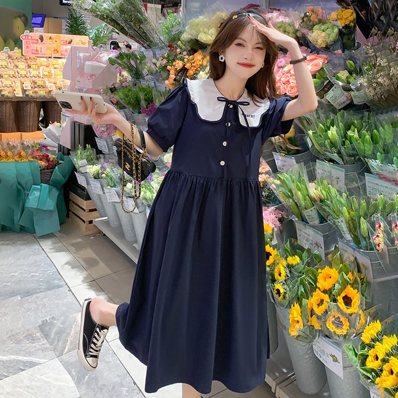 Φορμάκι εγκυμοσύνης για θηλασμό με κουμπιά μπροστά, γιακά τύπου λαπέλ, φούσκωτα μανίκια 3/4, φούστα με πατγουόρκ σε μεσαίο μήκος, ύφασμα πολυεστέρα-βαμβάκι (70–80% βαμβάκι).