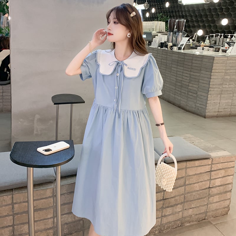 Φορμάκι εγκυμοσύνης για θηλασμό με κουμπιά μπροστά, γιακά τύπου λαπέλ, φούσκωτα μανίκια 3/4, φούστα με πατγουόρκ σε μεσαίο μήκος, ύφασμα πολυεστέρα-βαμβάκι (70–80% βαμβάκι).