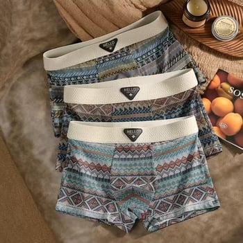 Férfi alsónemű - lélegző, gyorsan száradó, varrás nélküli, középmagas derekú boxer brief; poliészter anyag, belső Milk Silk betét; kamuflázs és virágminták